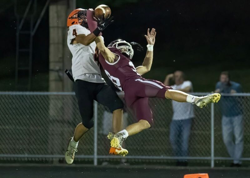 Chatfield’s Sam Carrier gets the pass deflection on a ball intended for St. Charles’ Saevian Hong in the #2 in AA Gophers 51-8 win over the Saints. Chatfield remained perfect at 6-0. Photo by Leif Erickson