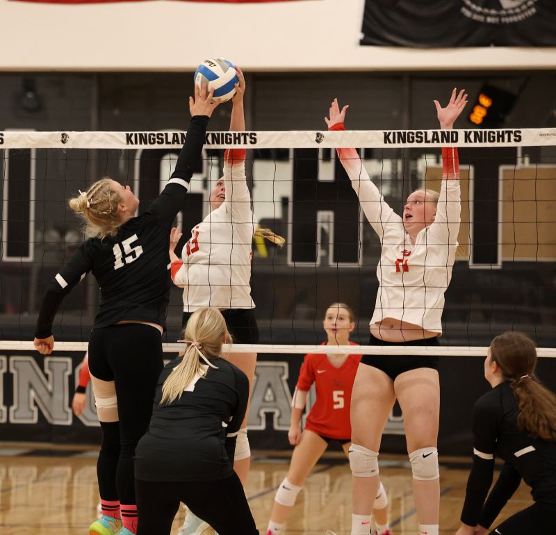 Kingsland’s Caisa Kolling gets denied at the net by LeRoy-Ostrander’s Miranda Nagel while Cardinal Kendall OIson is also pictured. L-O swept the match 3-0. Photo by Christine Vreeman