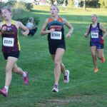Lanesboro/Fillmore Central’s Lillyan Kiehne and GMLOS’ Naomi Warmka trail Dover-Eyota’s Hannah Halbakken early at the St. Charles cross country meet. Kiehne finished 15th and Warmka 17th to crack the top 20 at said meet. Photo by Paul Trende