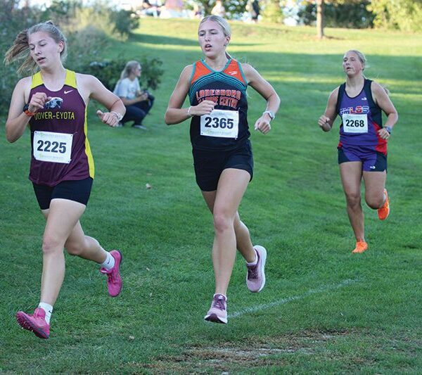 Lanesboro/Fillmore Central’s Lillyan Kiehne and GMLOS’ Naomi Warmka trail Dover-Eyota’s Hannah Halbakken early at the St. Charles cross country meet. Kiehne finished 15th and Warmka 17th to crack the top 20 at said meet. Photo by Paul Trende