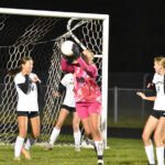 Caledonia/SG/Houston goalkeeper Alexis Qualy grabs the ball while defending a corner kick during the section tournament versus La Crescent-Hokah, a 5-1 Lancer win. Photo by Lee Epps
