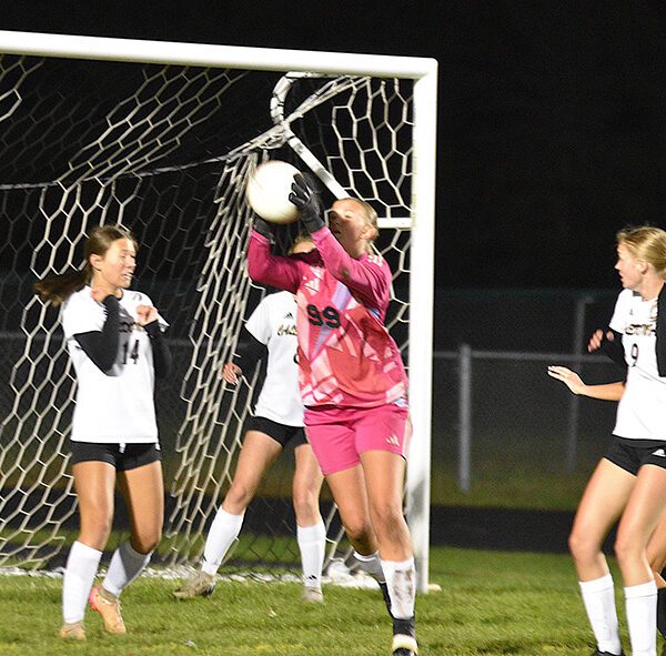 Caledonia/SG/Houston goalkeeper Alexis Qualy grabs the ball while defending a corner kick during the section tournament versus La Crescent-Hokah, a 5-1 Lancer win. Photo by Lee Epps