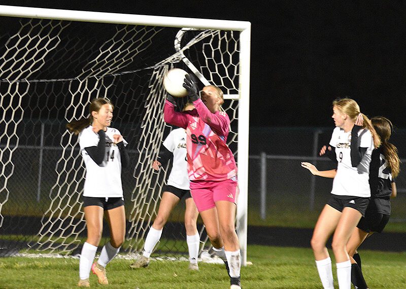 Caledonia/SG/Houston goalkeeper Alexis Qualy grabs the ball while defending a corner kick during the section tournament versus La Crescent-Hokah, a 5-1 Lancer win. Photo by Lee Epps