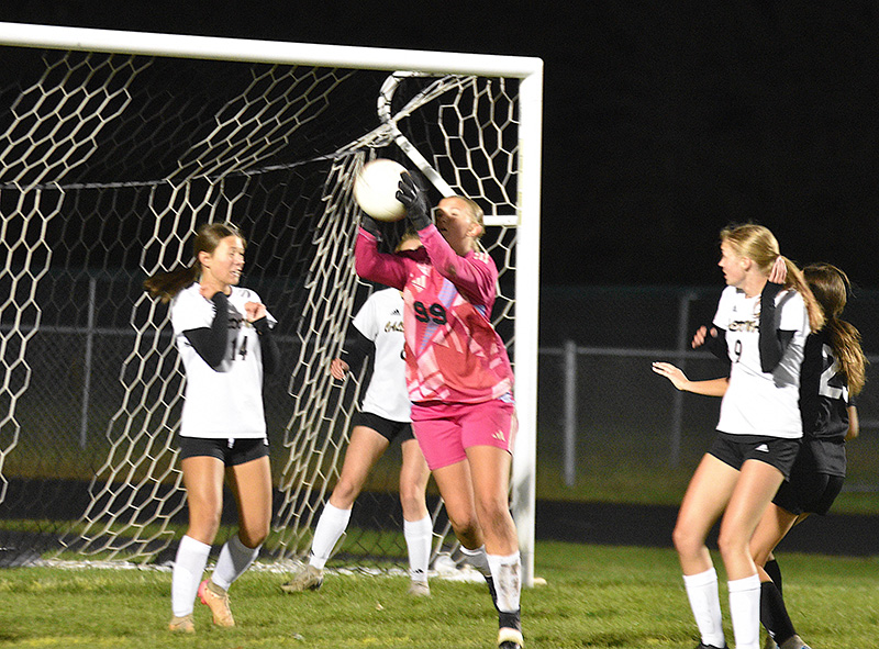 Caledonia/SG/Houston goalkeeper Alexis Qualy grabs the ball while defending a corner kick during the section tournament versus La Crescent-Hokah, a 5-1 Lancer win. Photo by Lee Epps