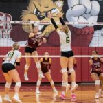 Chatfield’s Cora Bicknese goes high to attack against Rushford-Peterson’s Ava Helgemoe. Chatfield (7-2, 19-7) swept the Trojans (6-2, 11-3) in a match of top four TRC teams while also taking third of 32 at the large-school Burnsville Tourney. Photo by Leif Erickson