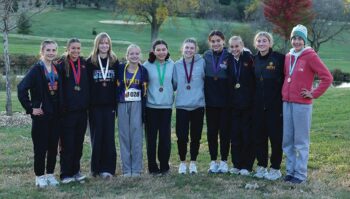 The Section 1A Meet top 10 girls finishers. Heading the cast is LFC’s Autumn Rakosnik (far left), who was meet champion. LARPH’s Caitlin Bauer (second from right) took ninth and was one spot short of making state. Photo by Christine Vreeman