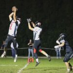 Spring Grove’s Dylan Halverson ends a Kingsland threat by making an interception at the goal-line for a pass intended for Kingsland’s Michael Johnson. Lion Ezra Konkel is also shown. For a second straight week, the Lions (4-1, 4-1) scored late to earn victory, this time handing #2 in 9-Man Kingsland (4-1, 4-1) its first loss via a 14-8 win. Photo by Christine Vreeman