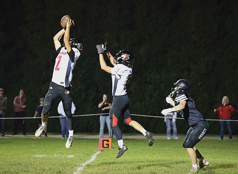 Spring Grove’s Dylan Halverson ends a Kingsland threat by making an interception at the goal-line for a pass intended for Kingsland’s Michael Johnson. Lion Ezra Konkel is also shown. For a second straight week, the Lions (4-1, 4-1) scored late to earn victory, this time handing #2 in 9-Man Kingsland (4-1, 4-1) its first loss via a 14-8 win. Photo by Christine Vreeman