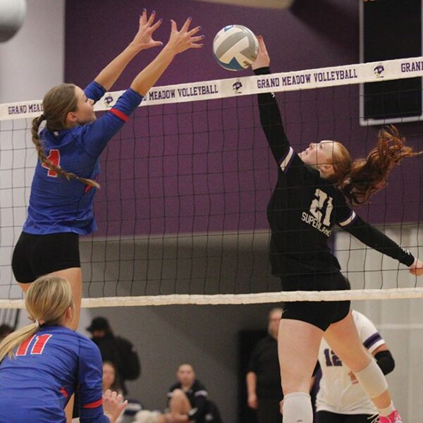 Grand Meadow’s Gracie Foster flicks the ball just past Mabel-Canton’s Ella Halverson in the teams’ SEC finale. Both teams entered the match undefeated in league play, but the Cougars (28-3) won both the above meeting 3-0, and the SEC East-West Showcase game, between the teams a night later. Photo by Paul Trende