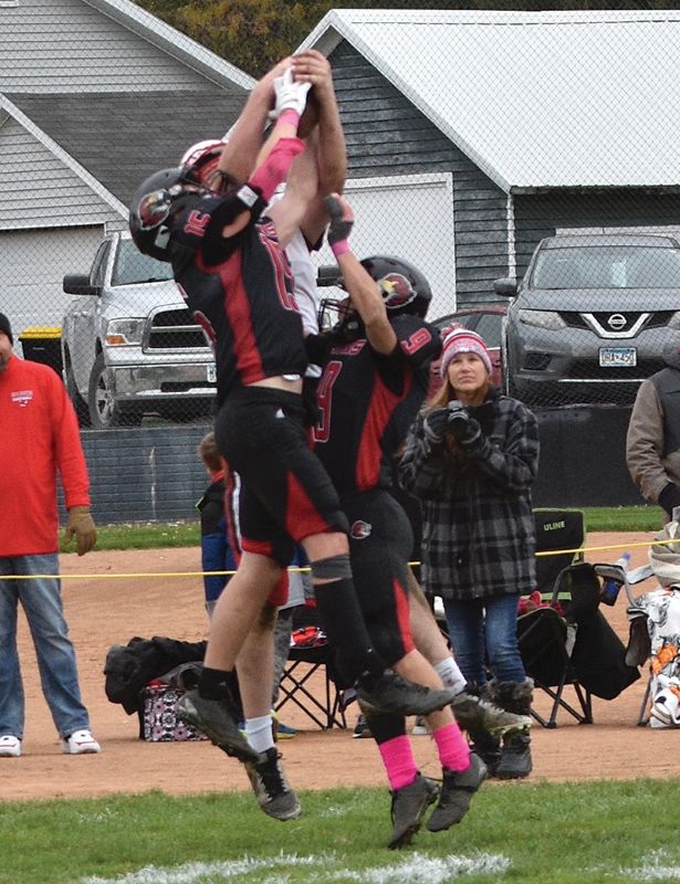 Spring Grove’s Caden Gerard intercepts a pass intended for Wabasha-Kellogg’s Bryar Ender in the teams 9-Man play-off semifinal. Gerard had two picks in the game to set the Lion single-season mark at eight, and SG topped first Grand Meadow 50-6 then the Falcons 35-20 to make the section finals. Photo by Lee Epps