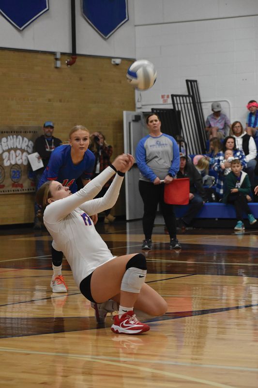 Mabel-Canton libero Lauren Burke pops up an attack in the Cougars’ Round of 16 volleyball match with Houston. Via 3-0 sweep, #6 in Class A M-C moved on to the 1A quarterfinals in Rochester. Photo Heather Kleiboer