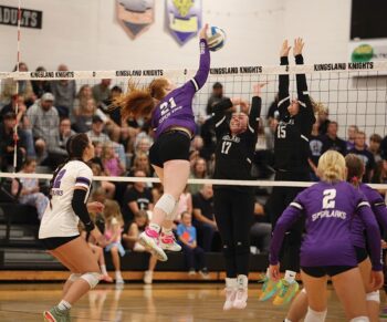 Grand Meadow’s Gracie Foster goes high to hammer a shot toward the waiting double block of Kingsland defenders Emma Howard (#17) and Caisa Kolling (#15). SEC-West leading GM (9-0, 17-4) downed Kingsland and G-E each 3-0 to run their win streak to nine matches. Photo by Christine Vreeman