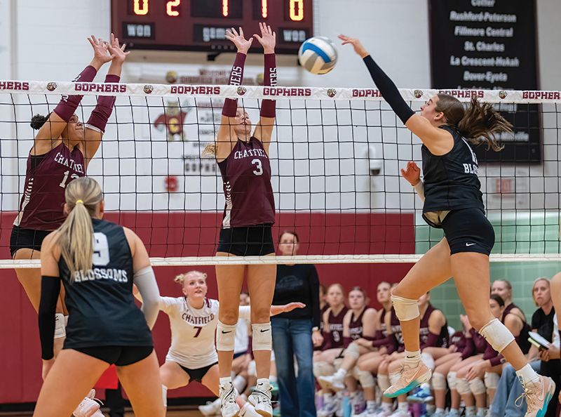 Chatfield defenders Amaya Harmening (left) and Grace Schroeder (right) defend against the attack of Blooming Prairie’s Elaine Schwarz in the teams’ 1AA Round of 16 game. Via a 3-0 sweep, the #4 in AA Gophers moved on to a 1AA quarterfinal. Photo by Leif Erickson