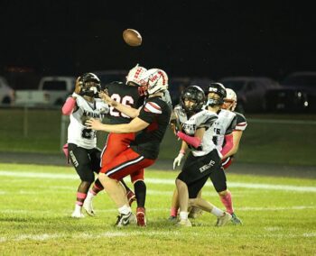 In one of the rarest football plays, Kingsland’s Kaaleem Reiland has his punt blocked, but he caught it, and then turned it into a 66-yard TD run, part of the Knights 42-26 win over Wabasha-Kellogg! Kingsland (5-1, 5-1) is in second place behind #4 M-C (6-0, 6-0) in the South-East. Photo by Christine Vreeman