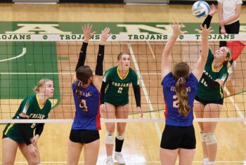 Rushford-Peterson’s Brielle Schneider attacks against the Southland defense of Breeley Galle (#4) and Juliette Matheis (#21). The Trojans downed the Rebels 3-1 while also beating La Crescent/Hokah by sweep, as R-P improved to 9-2 on the year. Photo by Craig Johnson