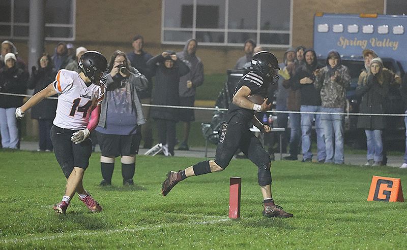 Kingsland’s Bently Wiersma sneaks across the goal-line late in the first half as Lanesboro’s Preston Clarke looks on. The game’s only score, a 23-yard pass play with 0:32 left in the first half, propelled Kingsland to an 8-0 win. Photo by Christine Vreeman