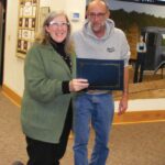Mayor John McBroom presents Kay Wangen, finance and information systems director, with a certificate in recognition of her 25 years of service to Chatfield. Photo by Karen Reisner