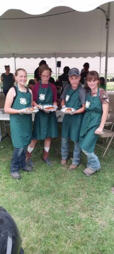 Ada Zoellner, Kathleen Zoellner, Cash Dahl and Jaxie Dahl at the Winona County Fair grilling competition. This contest was new in 2024; the club members won first place in back-to-back years.