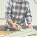 Eitzen Mayor Jeff Adamson looking at siding colors for the community center during the city’s October council meeting. Photo by Charlene Corson Selbee