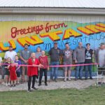 A crowd of organizers, volunteers, city officials, and mural artist Geri Ann Hanson at the October 1 Fountain mural ribbon cutting. Photo by Kirsten Zoellner