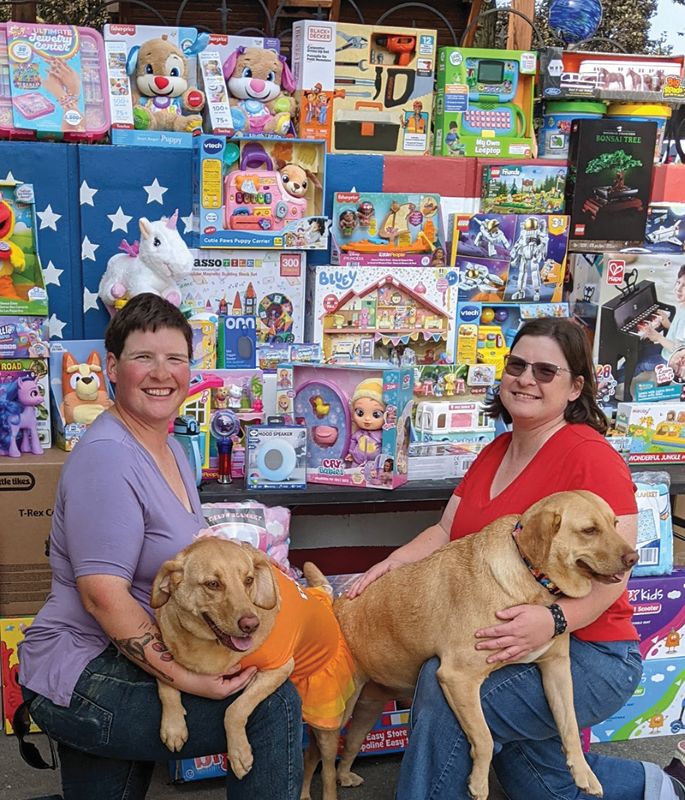 The combination of twin sisters Rachel and Faith Knopps with litter mates Ariel and Rosie bring a double dose of joy to those in local hospitals. Photo by SimplyMary