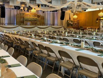 The venue has a stage for the wedding party to be seated on. The bridal suite and groom’s den are located in rooms in back of the stage. Photo by Wanda Hanson