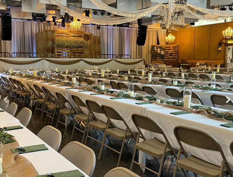 The venue has a stage for the wedding party to be seated on. The bridal suite and groom’s den are located in rooms in back of the stage. Photo by Wanda Hanson