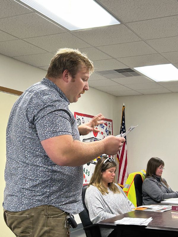 Aaron Johnson of SMIF visited the council to explain the benefits the city receives from SMIF. In the background from left to right are Emily Krage and City Administrator Michelle Quinn. Photo by Wanda Hanson