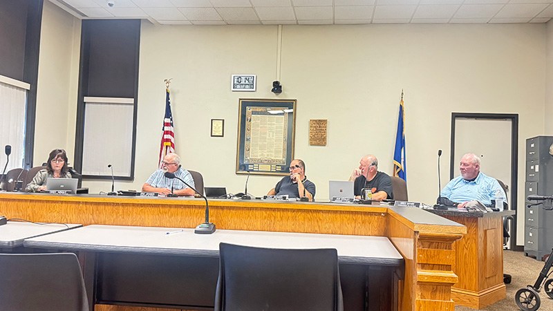 Houston County Commissioners listen intently as Commissioner Cindy Wright gives her report at the October 7 commission meeting. Photo by Charlene Corson Selbee