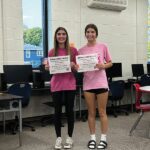 Hurricane Heroes Emma Brevig, left, and Lydia Pedretti, right, were recognized for their help during Back to School Night. Photo by Wanda Hanson