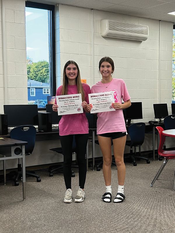Hurricane Heroes Emma Brevig, left, and Lydia Pedretti, right, were recognized for their help during Back to School Night. Photo by Wanda Hanson