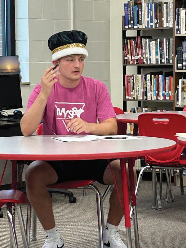 King Grayden Beckman reported to the school board on all the activities of Homecoming. Photo by Wanda Hanson