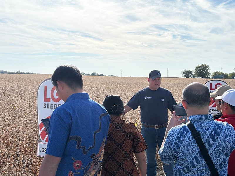 NSM Chair Glen Groth (in the dark blue shirt and cap) greets the tour at his farm. Photo submitted