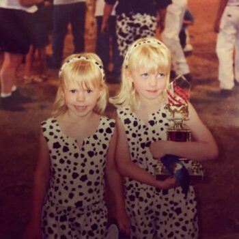 The young Leiding twins, Kayla and Haely posing in their cute Holstein attire holding their ribbons and trophies. Photo submitted
