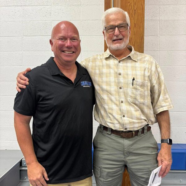 Second place in all-time career wins (885), Lonnie Morken was surprised by the presence of former Stewartville coach and mentor John Dzubay at Morken’s history-making volleyball game. Dzubay is in first place with 1,039 wins. Photo submitted