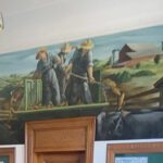 Hog Raising, an oil on canvas painting by Edmund Lewandowski, was created in the early 1940s as part of the New Deal. It is the only such mural located in a Fillmore or Houston County post office. Photo by Charlene Corson Selbee