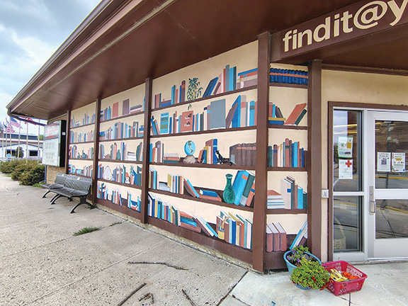 The mural on the Houston Library stands out along Main Street. Jean Colette, Jeannie Arentz and Kelley Stanage designed and supervised the project, while members of the Money Creek Livewires 4-H Club spent many hours volunteering to help paint the mural. Residents and visitors walking by also pitched in to help with the year-long project. Photo submitted