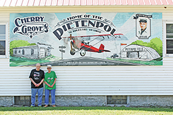 The Pietenpol mural is located on the exterior wall of the Cherry Grove community center. The mural recognizes the planes designed and built in the 1920’s by Cherry Grove resident Bernard Pietenpol. National Fleet Graphics of Dodge Center was hired to make the mural. Photo by Hannah Wingert