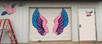 Looking for the perfect selfie backdrop? Stop at Threads in Chatfield, where angel wings designed and painted by Andrea Hindt brighten the wall. Photo submitted