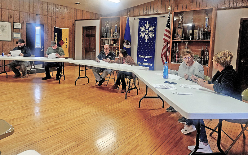 Mayor Stephanie Start and council members discuss city business during the October 7 meeting in Ostrander, including the October 21 maintenance review and the 421 Minnesota Street purchase. Photo by Zech Sindt