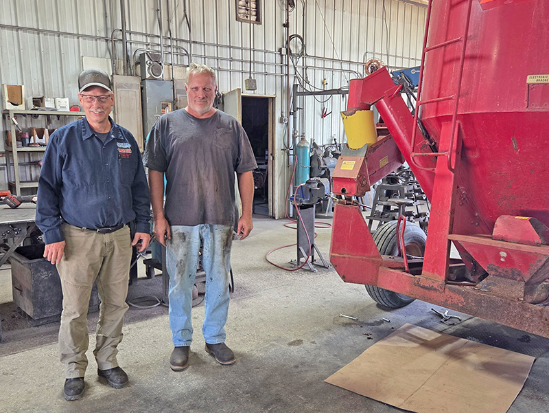 Dennis Solberg with Mark Reimann, who has been working at Solberg Welding for 27 years.