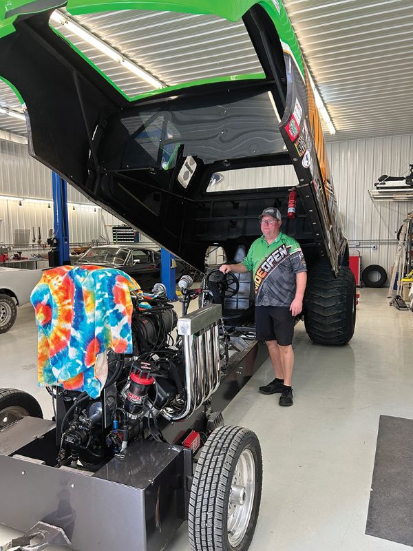 Roger poses with the truck in its storage area. Photo by Wanda Hanson