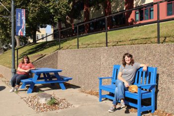 A portion of the grant money was dedicated to three “pocket parks,” an upgrade to the south side of the Fillmore County government center in the downtown area. Pictured are Preston EDA Director Michelle Marotzke sitting at a picnic table and Preston Tourism Director Mandy Huston resting on a nearby park bench. This presents opportunities for locals and tourists to take a break and enjoy the downtown area. Photo by Jason Sethre