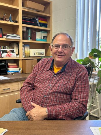 Pastor Mark shared the family history of Old Blue, a 1961 Mercedes Benz. Photo by Wanda Hanson