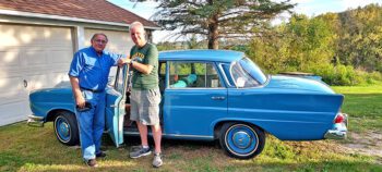 Mark posed with Steve Erickson and Old Blue when he picked up the car after its most recent repairs. Photo submitted