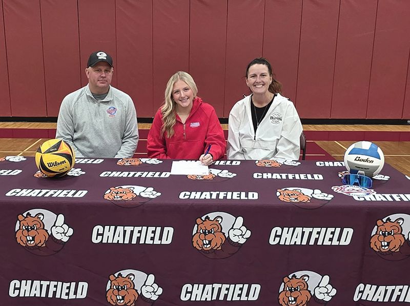 Chatfield’s Hannah Tweten recently signed a letter of intent to play college beach volleyball at Florida Southern College. She is pictured with dad Brent Tweten and Coach Kristi Rindels. Photo submitted
