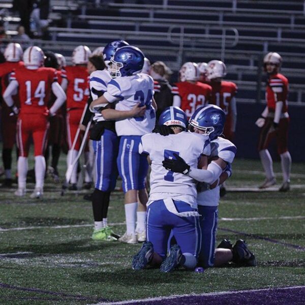 Somewhere between Mabel-Canton consoling players Isaac Underbakke and Kale Eiken (left), and Darian Hershberger and Milton Hutchinson (right), is where the Cougars’ season ended. Down 40-38 with the clock reading 0:00, an M-C two-point try failed, as Hillcrest Lutheran moved on to the 9-Man state semifinals. Photo by Paul Trende