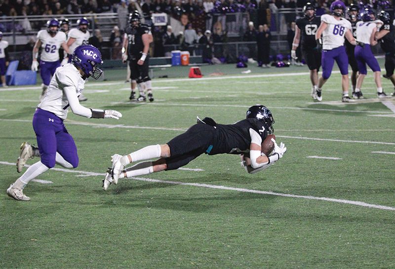 Fillmore Central junior Quinci Kaase makes a nice diving catch late in the Falcons’ state quarterfinal loss to Murray County Central, 29-26. Kaase caught six for 143 yards and two touchdowns while amassing another 45 yards rushing. Photo by Paul Trende