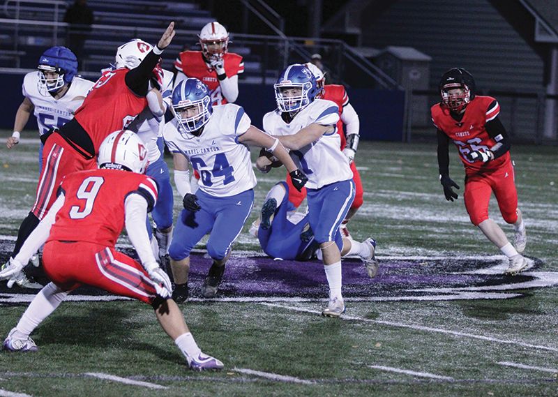 Mabel-Canton’s Kale Tollefsrud looks to run behind a block of senior teammate Kenny Hutchinson in the Cougars’ agonizing 40-38 loss to Hillcrest Lutheran in the state 9-Man quarterfinals. Photo by Paul Trende