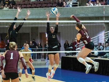 Chatfield’s Cora Bicknese gets a hard shot to deflect off a Caledonia defender (pictured are Kensey King and Ashlyn Reinhart) for the Section title-securing kill in the Gophers’ 3-1 win. Photo by Leif Erickson